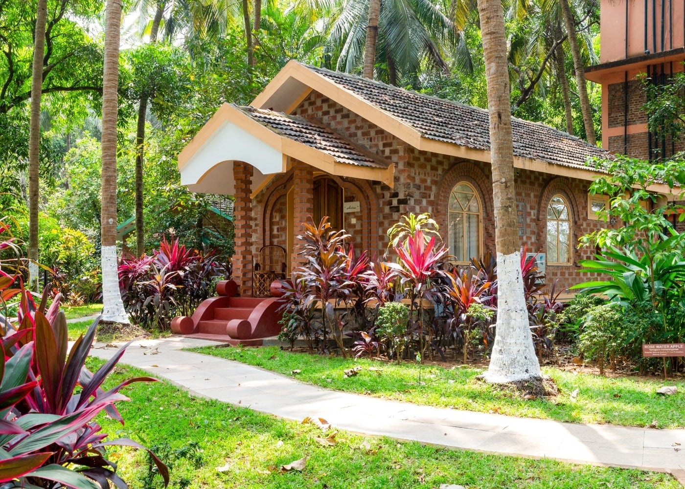 Classic Villa exterior — traditional Kerala design with garden path