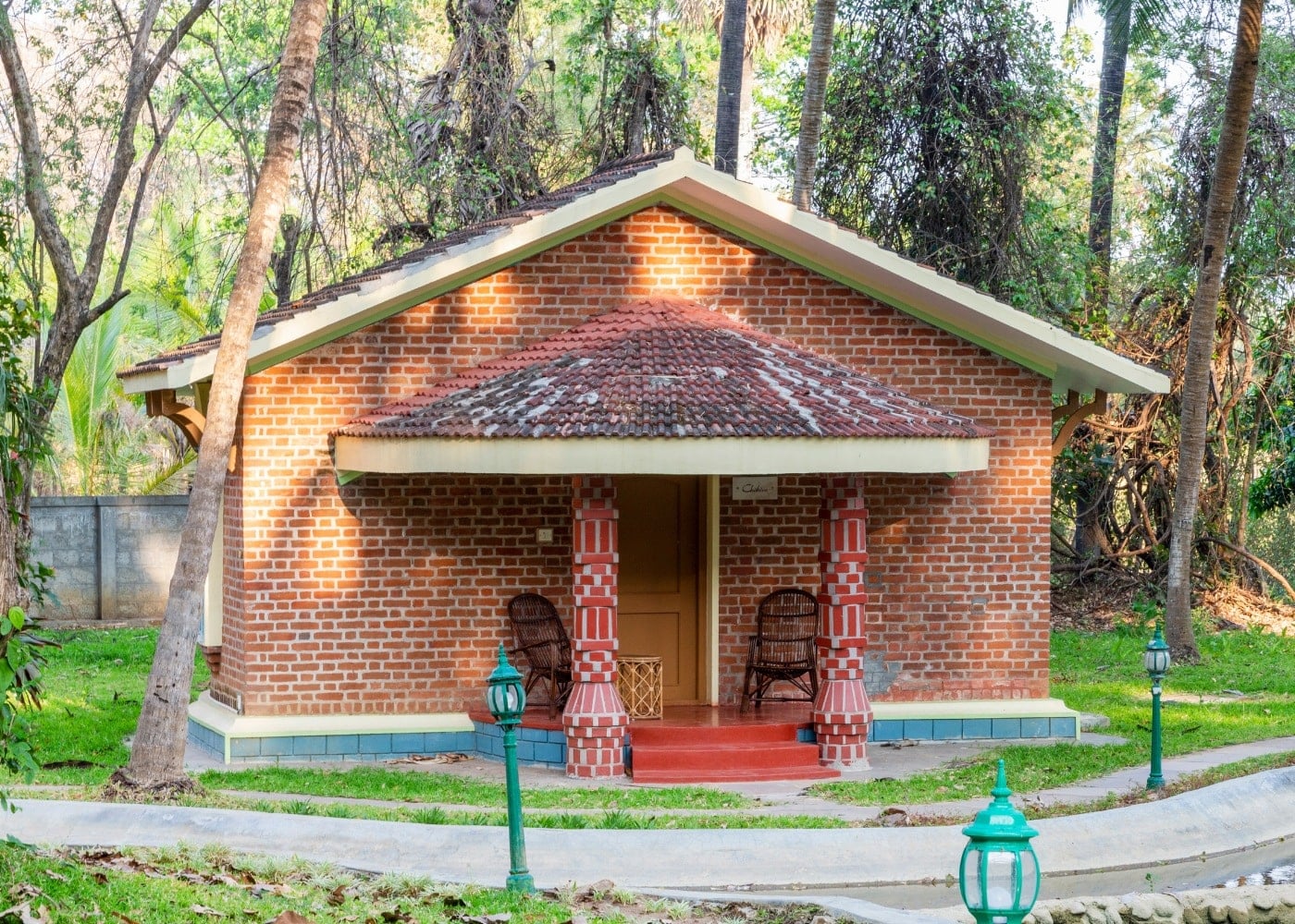 Deluxe Villa exterior — Kerala brick architecture with balcony