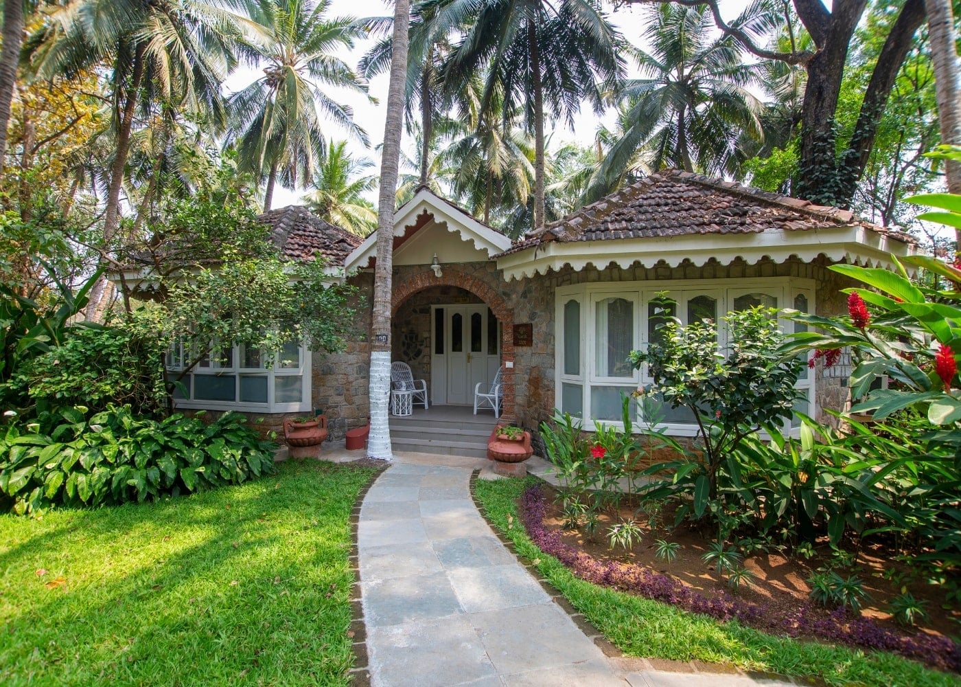 Maharaja Villa exterior — grand villa surrounded by palm trees
